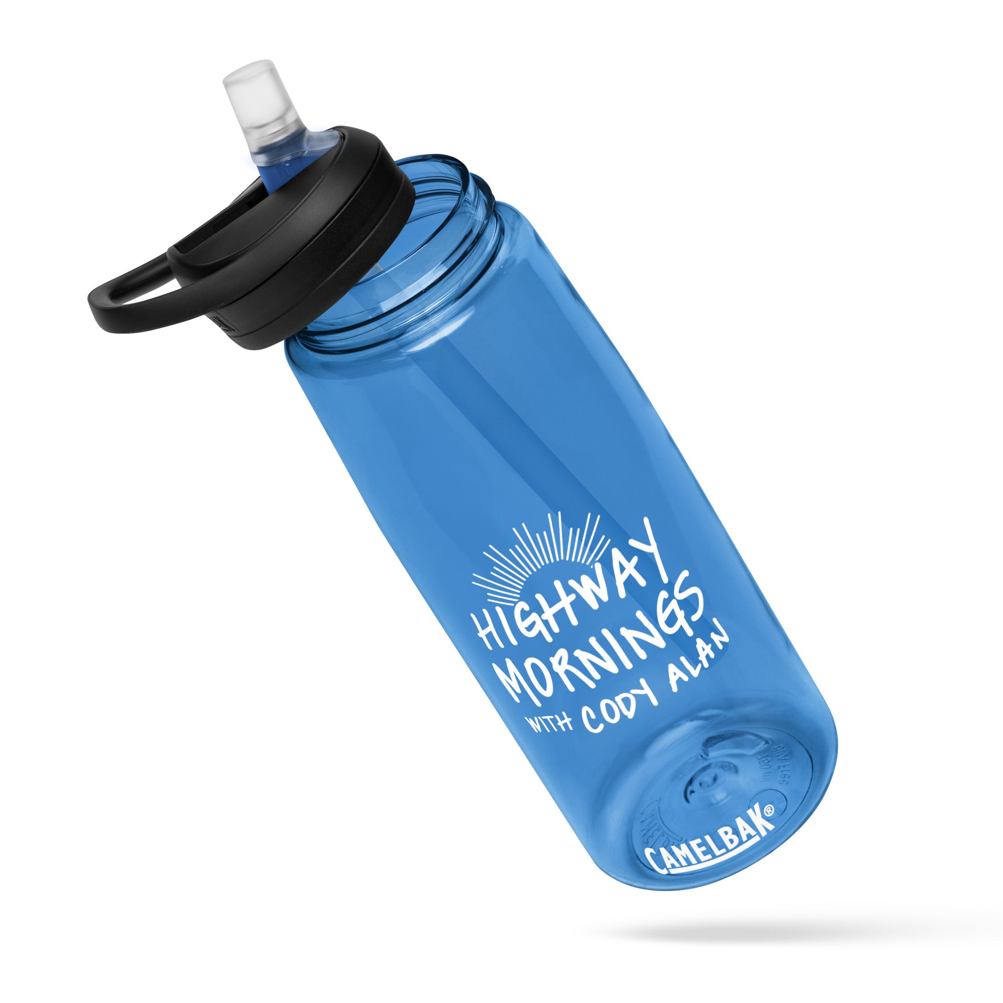 A blue CamelBak bottle shown at an angle with the flip-top lid open, displaying the white 'HIGHWAY MORNINGS WITH CODY ALAN' branding and sunburst design on the front.