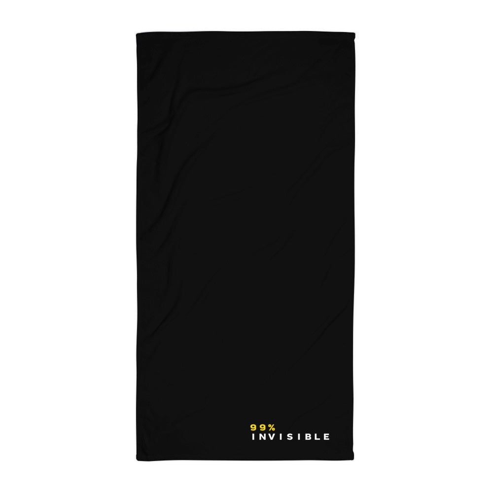 A black rectangular towel with a minimalist design. The horizontal text in the bottom-right corner reads '99%' is in yellow, while 'INVISIBLE' is in white. The text is clean and modern.