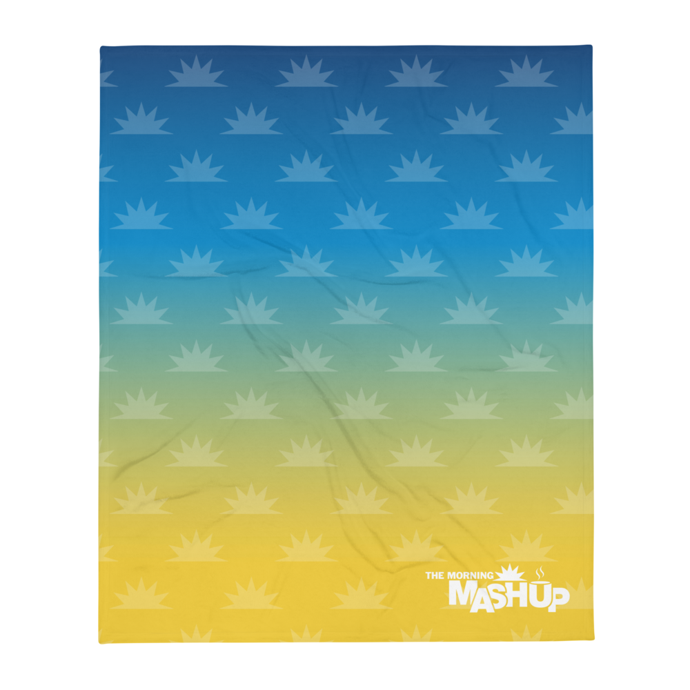 Blanket featuring a gradient blue to yellow background with a repeated sunburst pattern and the text 'THE MORNING MASHUP' in white font.