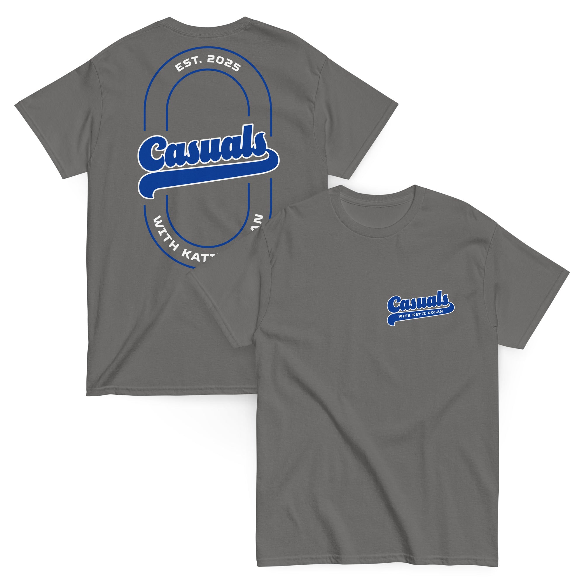 Charcoal short-sleeve t-shirt laid flat, showing the large blue and white back design with 'Casuals' in bold in the center, 'EST. 2025' above, and 'WITH KATIE NOLAN' curved below.