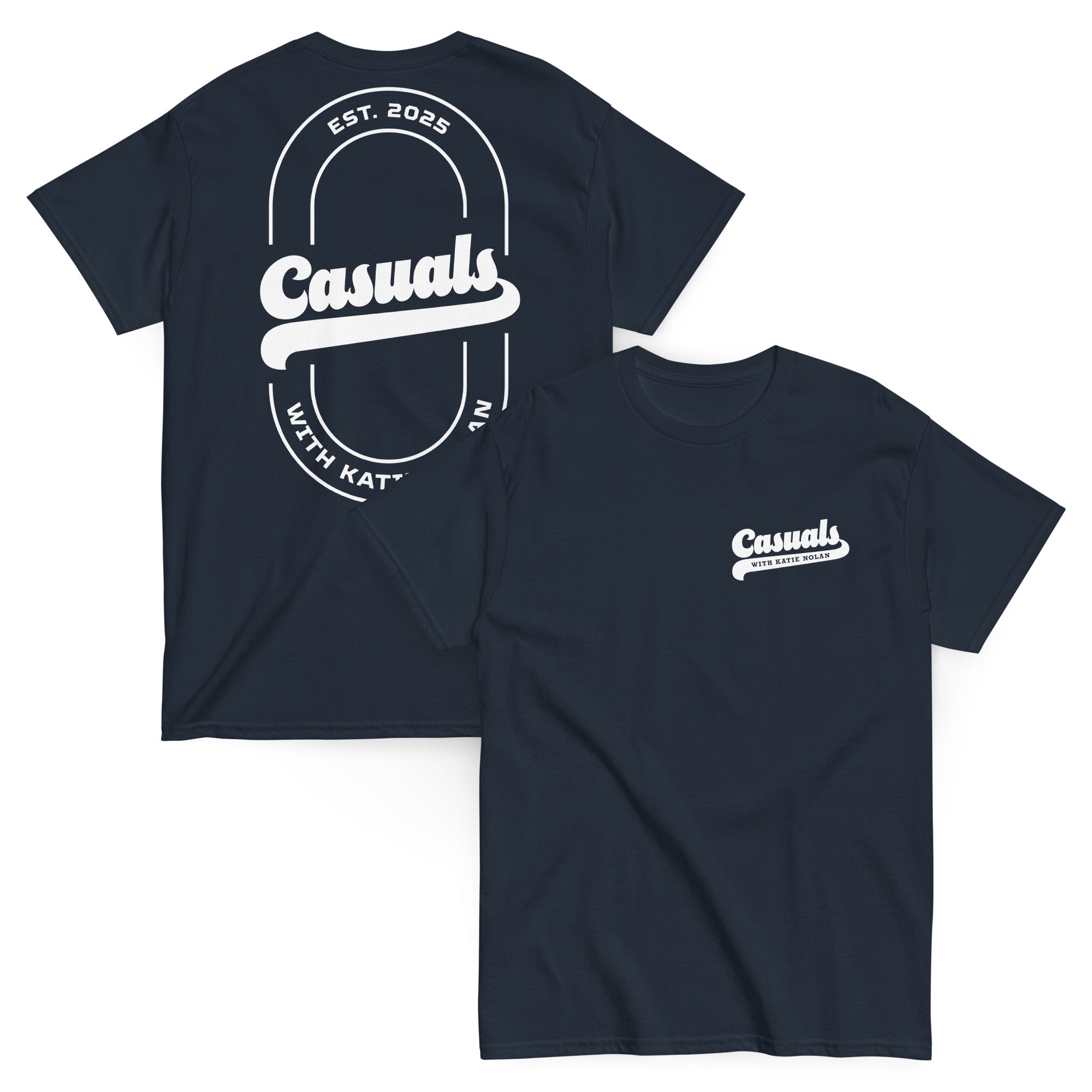 Navy short-sleeve t-shirt shown from both angles. Front: small white chest logo with 'Casuals' and 'WITH KATIE NOLAN' below. Back: large oval outline with 'Casuals' in bold, 'EST. 2025' above, and 'WITH KATIE NOLAN' curved below.v