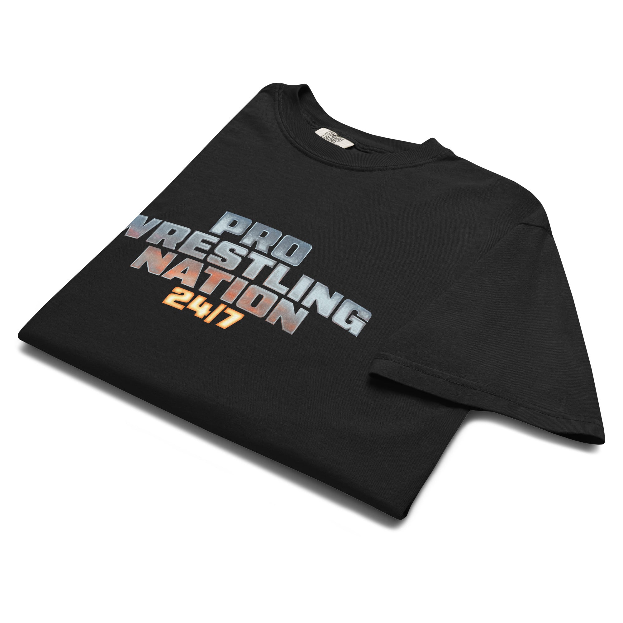 Black heavyweight T-shirt neatly folded, showing the front chest graphic: 'Pro Wrestling Nation 24/7' in a metallic gradient finish.