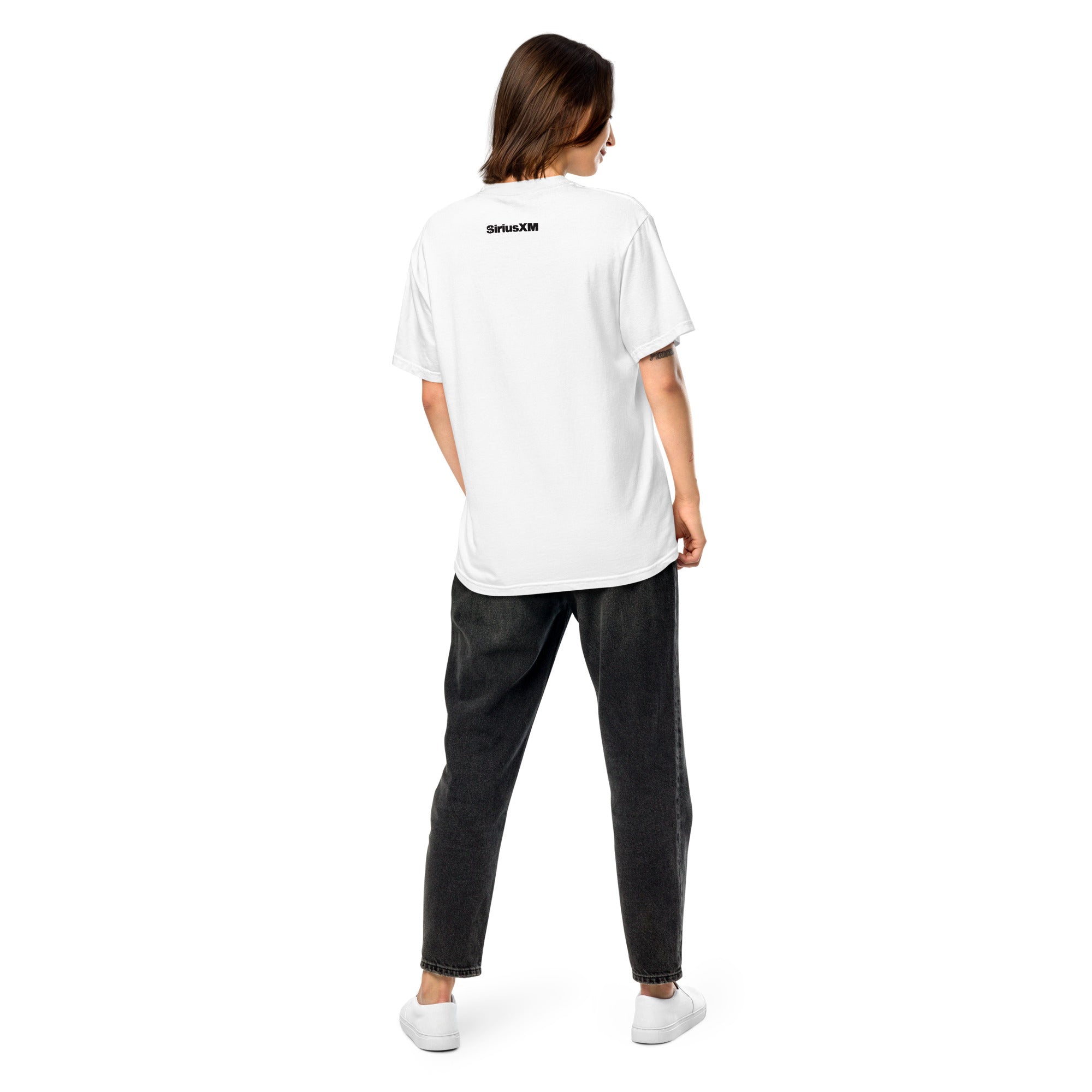 Back view of a female model wearing a white 'SiriusXM' T-shirt, shown standing in a relaxed pose with the logo centered below the collar.