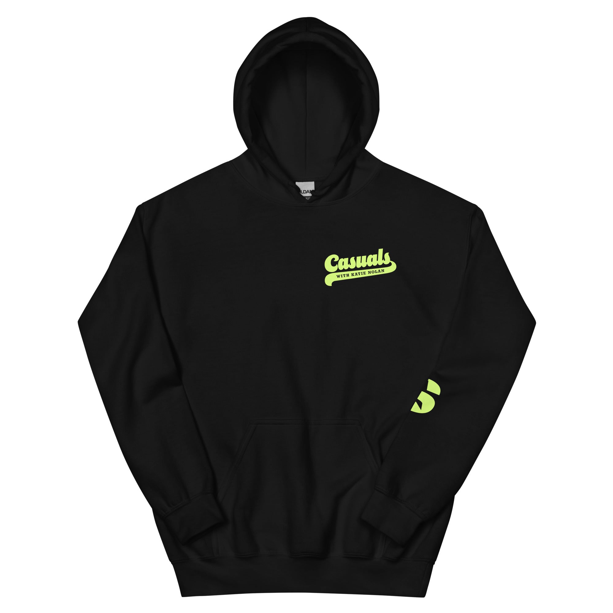 Flat lay of a black hoodie featuring the text 'Casuals with Katie Nolan' printed in large, light green retro script on the left chest. SiriusXM’s 'S-Star' logo is partially visible on the right sleeve, also in light green.