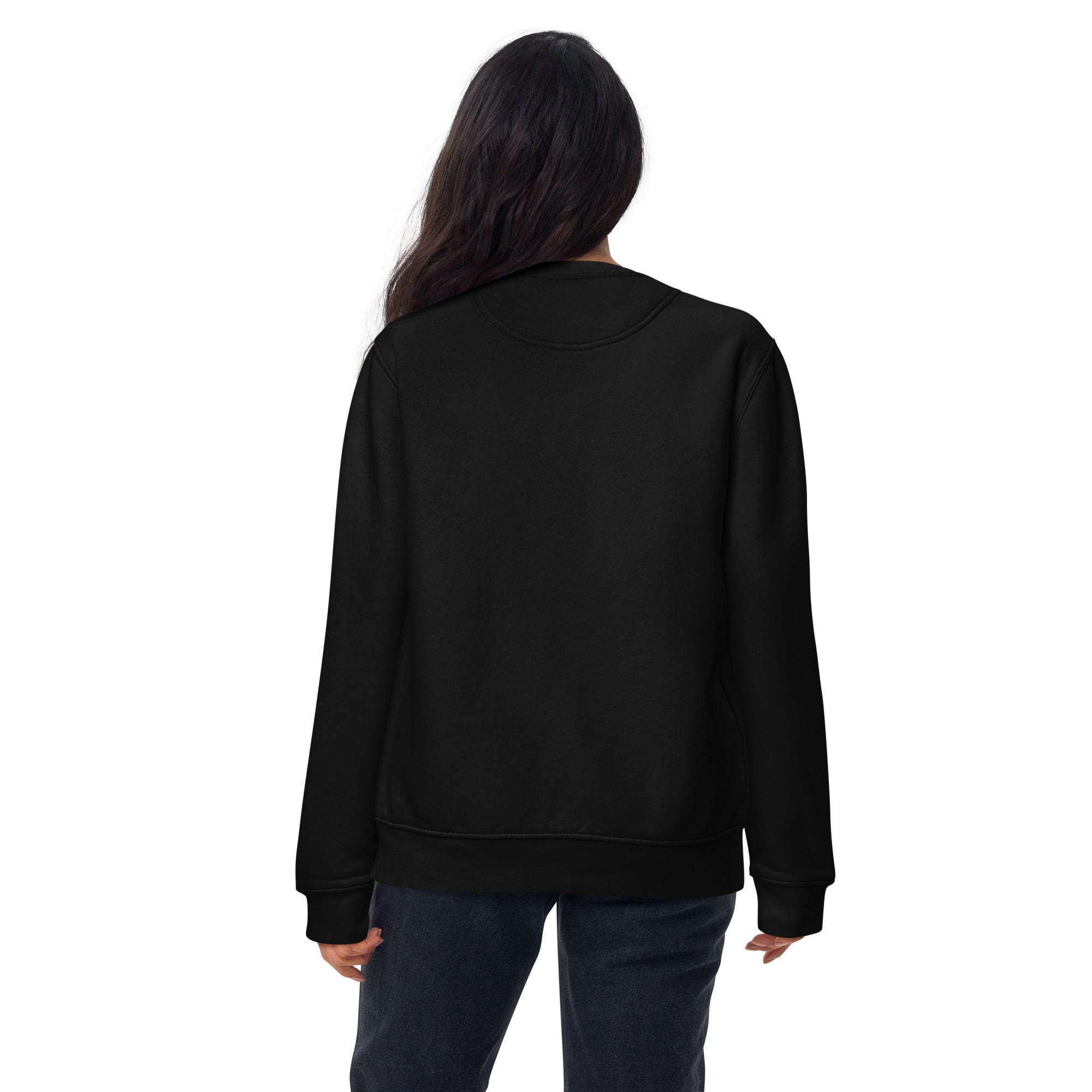 A woman shown from the back wearing a plain black crewneck sweatshirt and dark jeans. The back of the sweatshirt is solid black with no printed design or text.