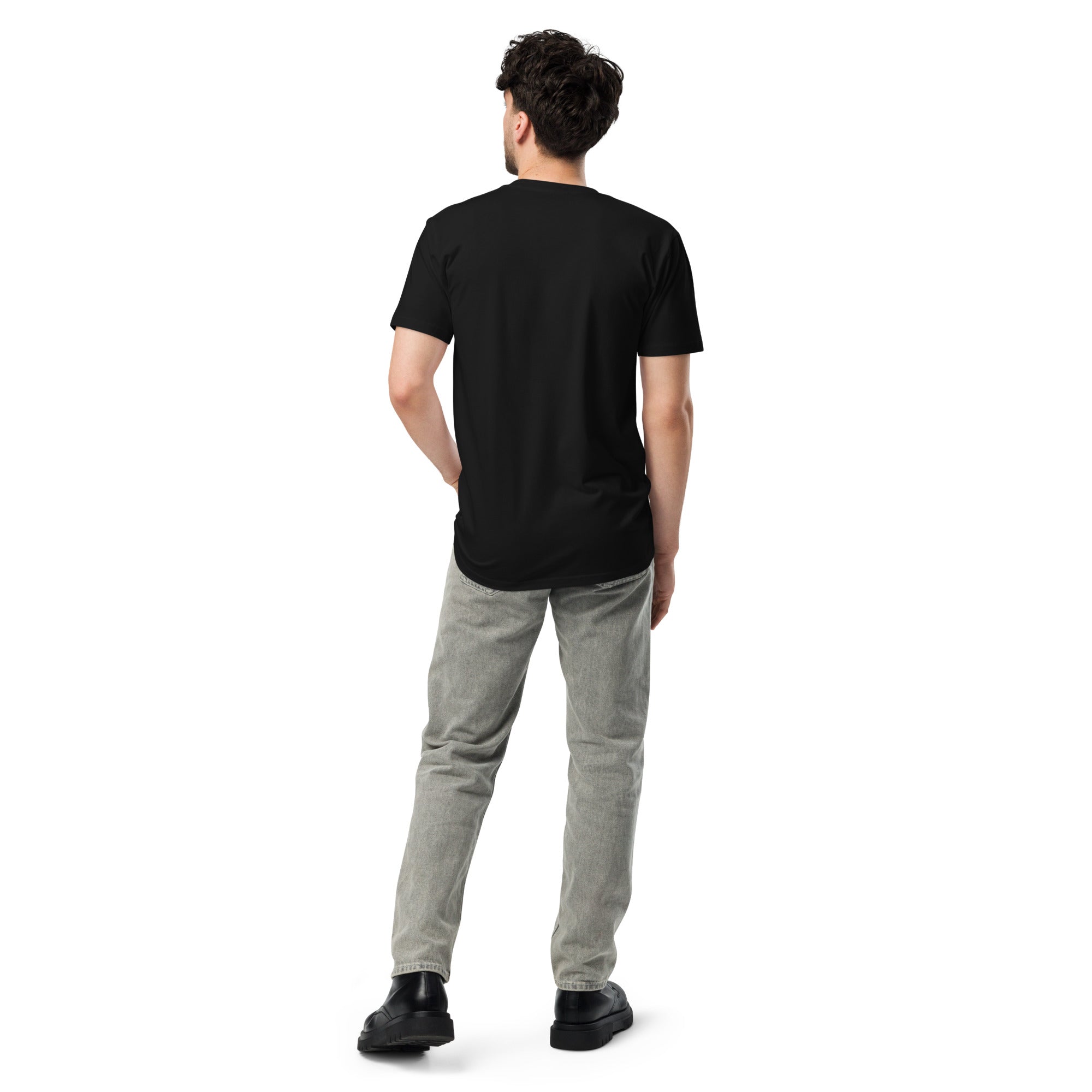 Man wearing a plain black unisex T-shirt, shown from the back, with no visible design.