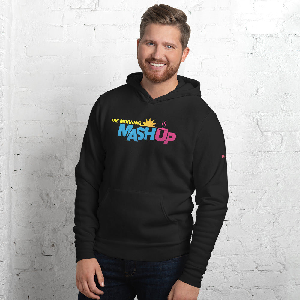 Man wearing a black hoodie with 'Morning Mash Up' logo on front against a white brick wall