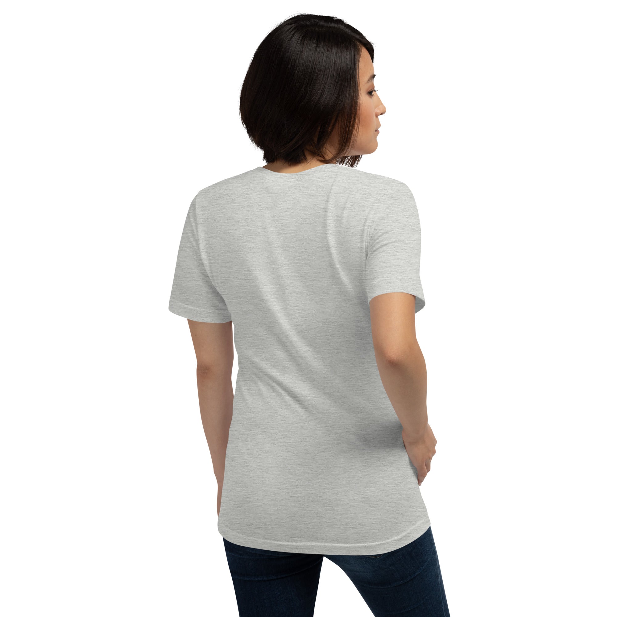 A woman is shown from the back wearing a heather gray unisex t-shirt with short sleeves and no visible graphics or text.