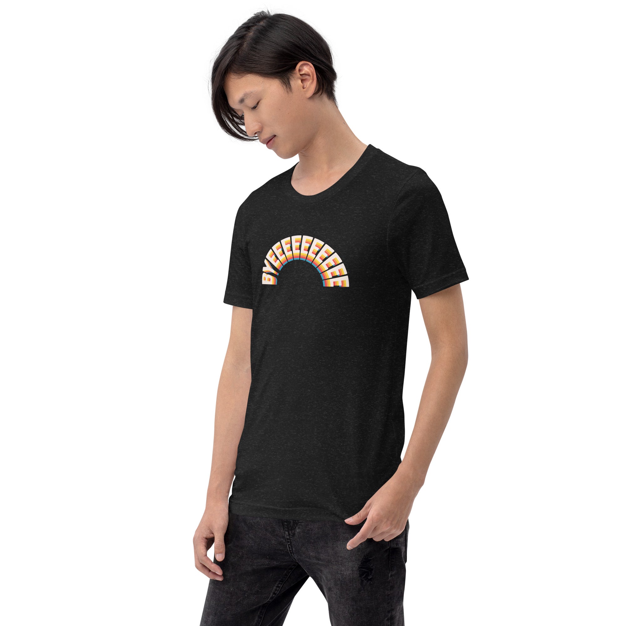 A man looking down while wearing a black heather T-shirt with the arched 'BYEEEEEEEE' graphic across the chest.