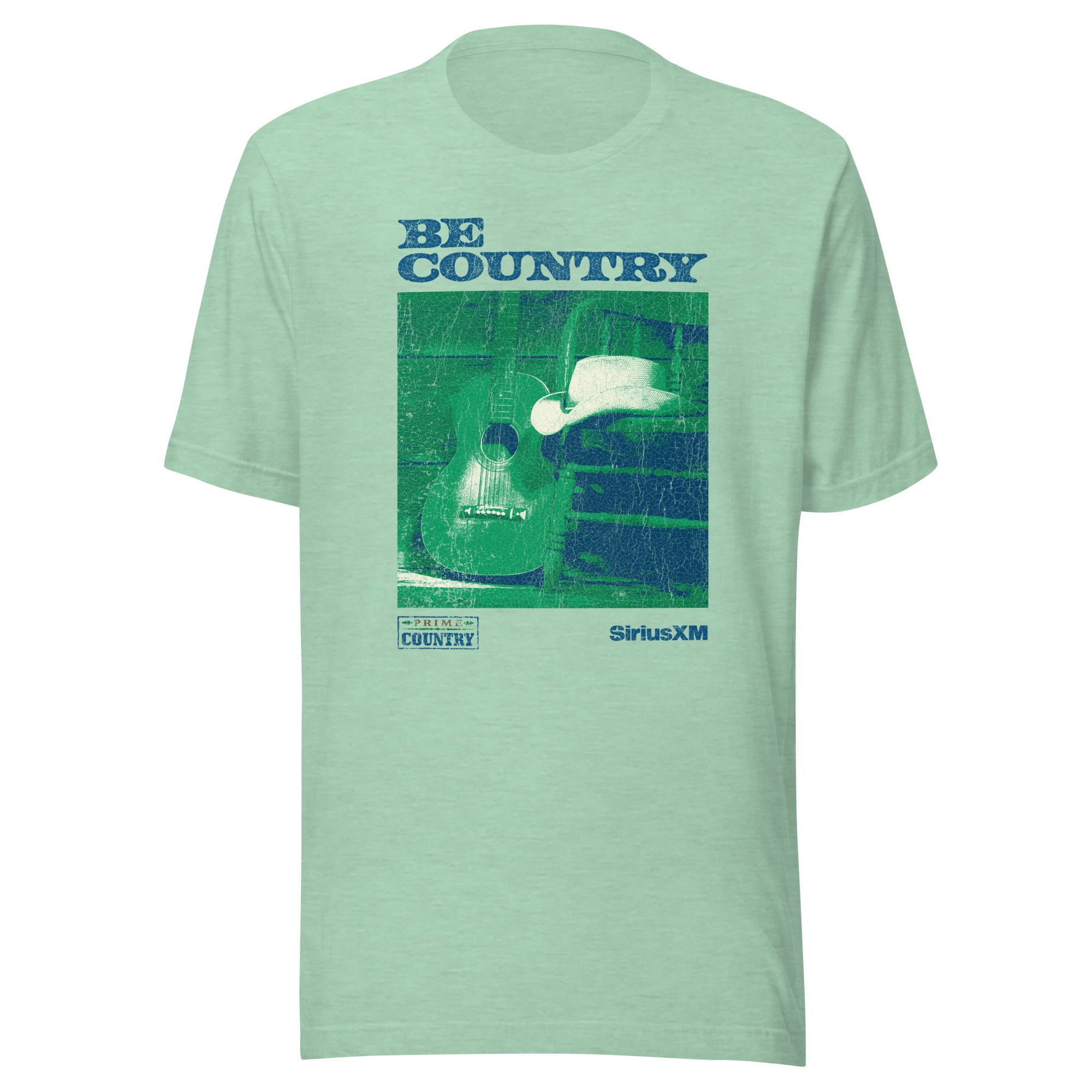 Front view of a mint green T-shirt with a distressed graphic featuring a guitar and cowboy hat. The design includes the phrases 'BE COUNTRY', 'PRIME COUNTRY', and 'SiriusXM'.
