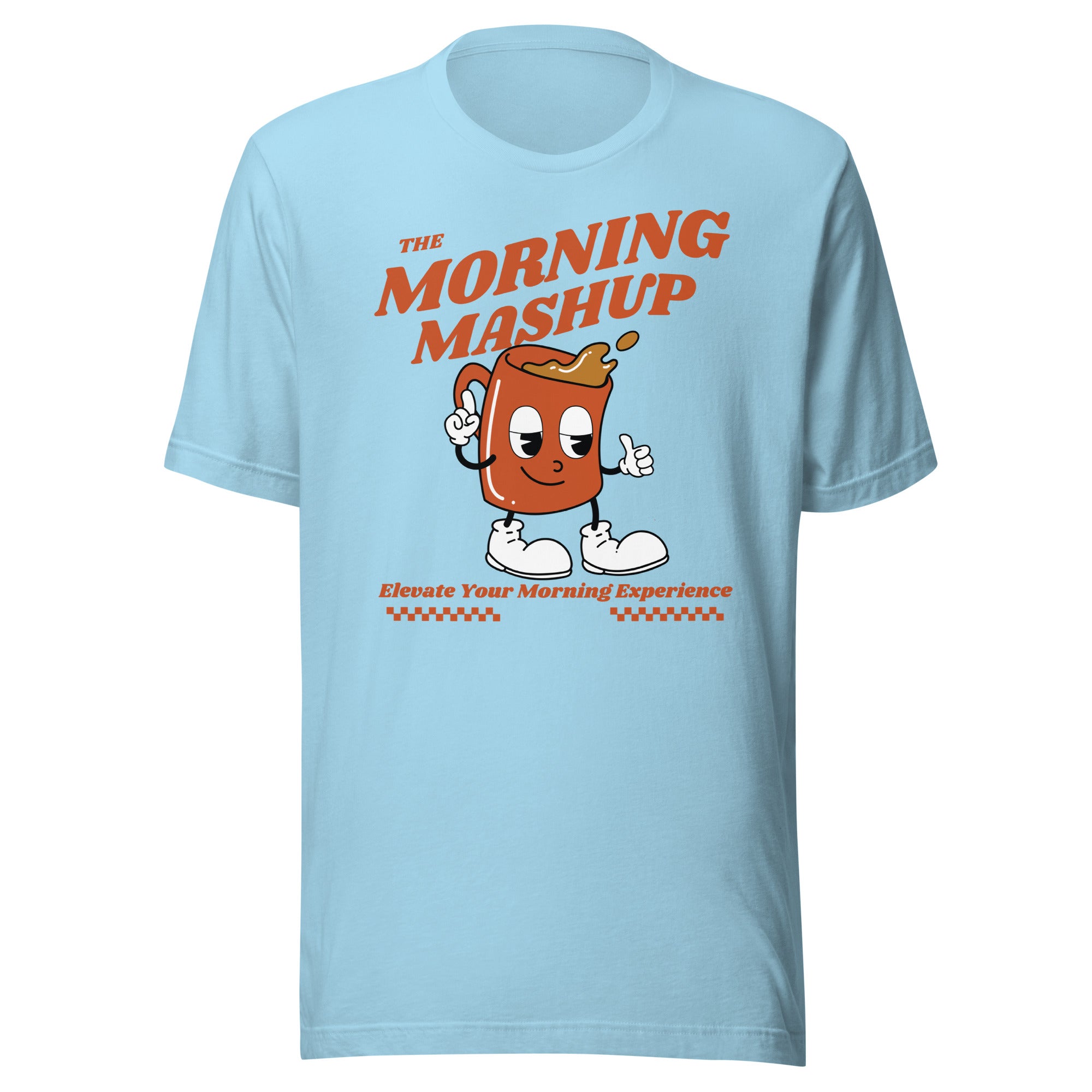 Light blue unisex T-shirt laid flat, showing a large central graphic of a smiling orange cartoon coffee mug with coffee spilling out. Text reads 'THE MORNING MASHUP' in large bold font above and 'Elevate Your Morning Experience' below with decorative checkered bars.