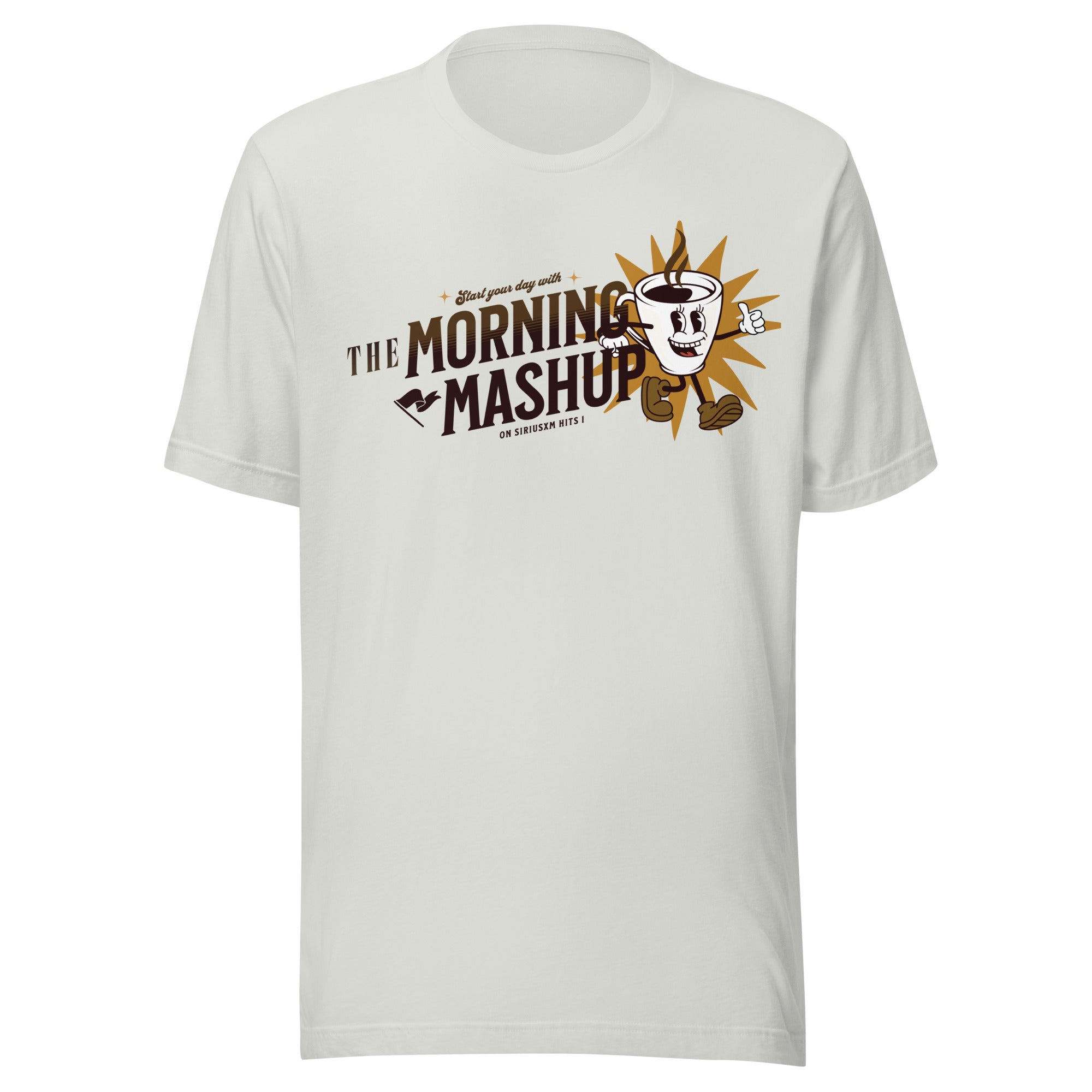 Light silver unisex T-shirt featuring a retro-style graphic of a smiling coffee cup character with arms and legs. The cup has steam rising from it and is positioned in front of a gold starburst. Text reads 'Start your day with THE MORNING MASHUP on SiriusXM Hits 1' in dark brown and gold lettering.
