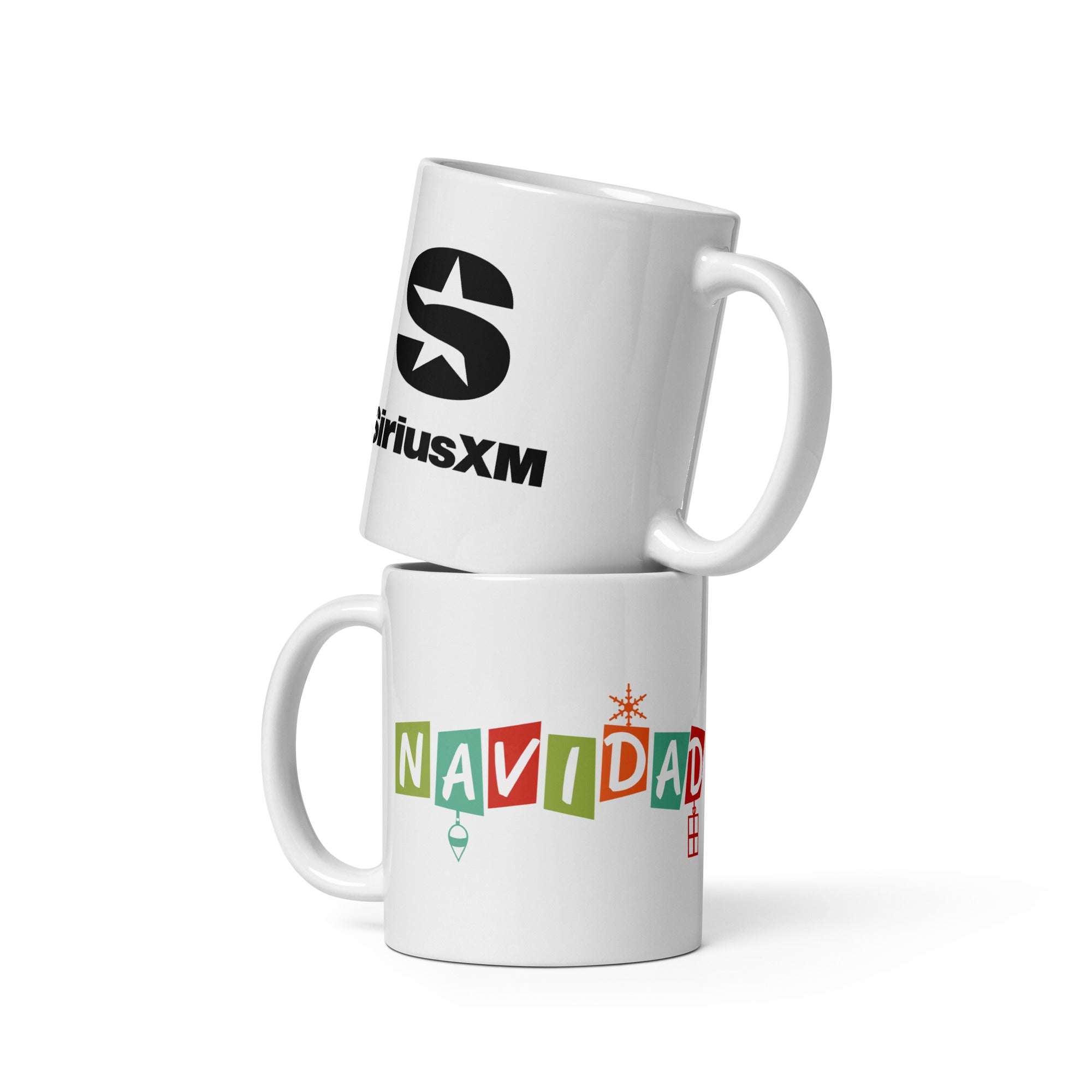 Two stacked white mugs, one featuring the SiriusXM logo and the other with the word 'NAVIDAD' written in colorful blocks.