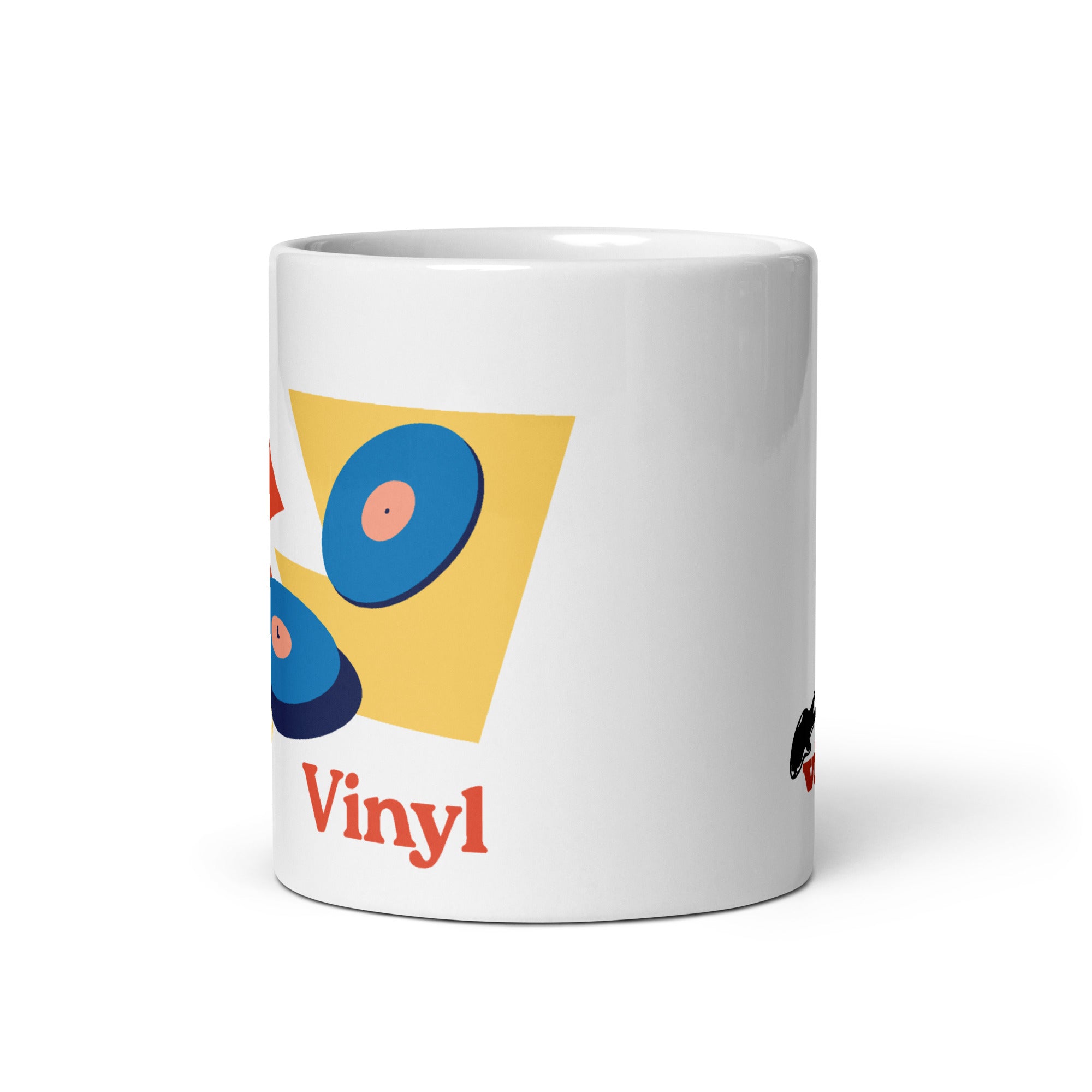 Front angled view of a white ceramic mug showing part of a colorful graphic with two blue vinyl records on a red and yellow background, and red text reading 'Vinyl' beneath the design.