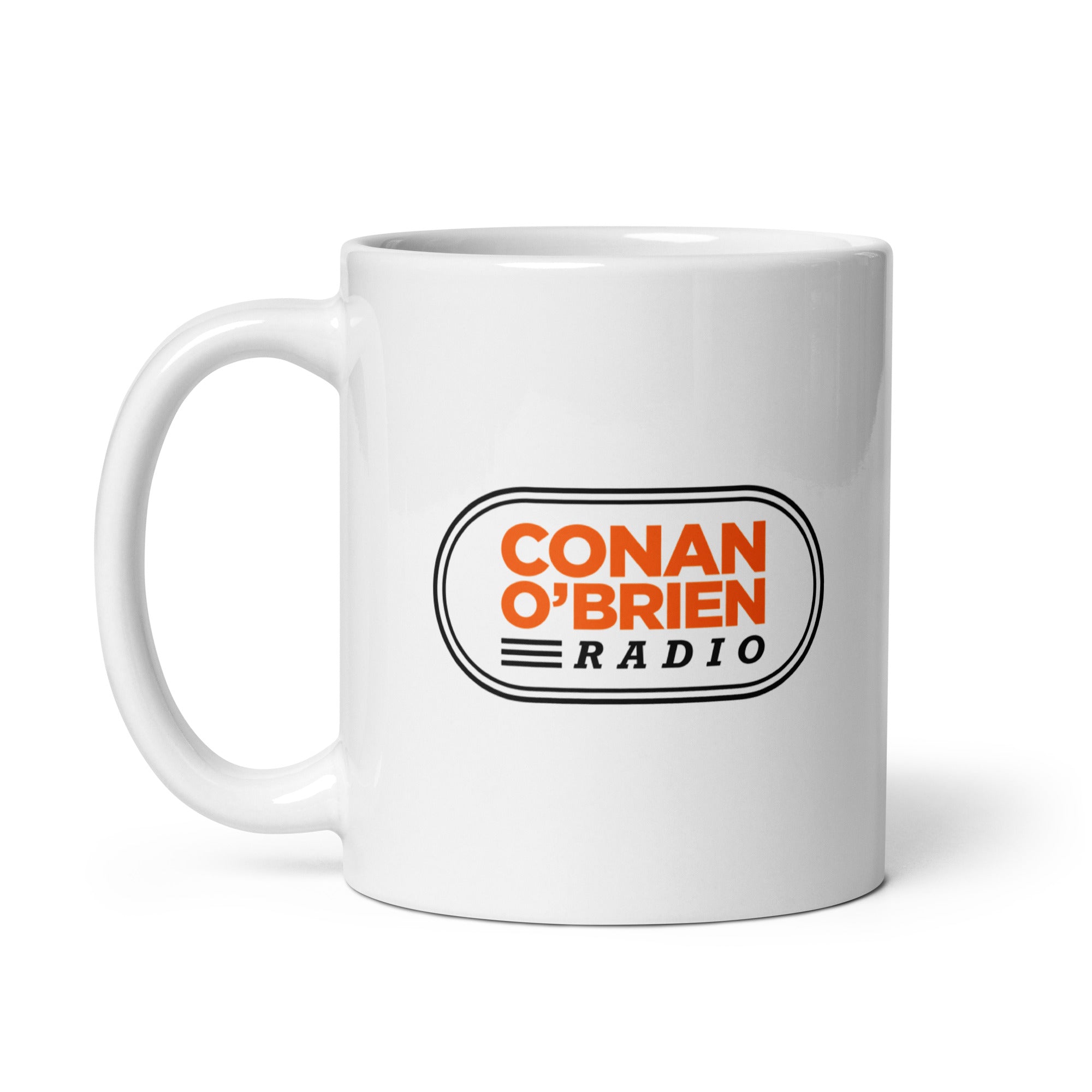White mug with 'CONAN O'BRIEN' and 'RADIO' logo in orange and black.