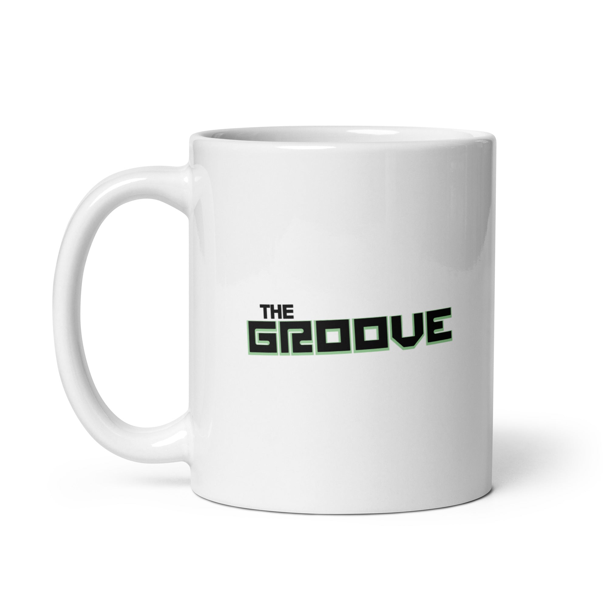 White mug with the text 'THE GROOVE' in bold black and green letters.