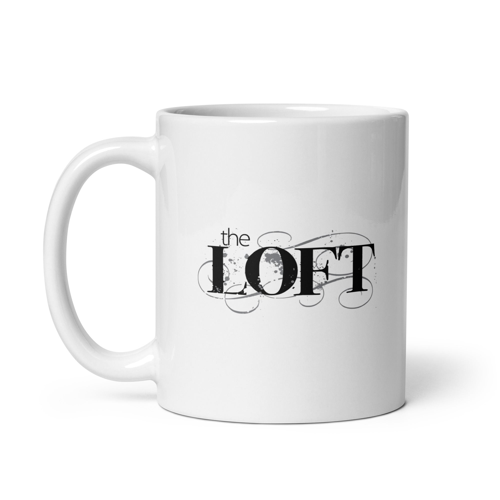 White coffee mug featuring the text 'the LOFT' in a stylized black font with decorative swirls.