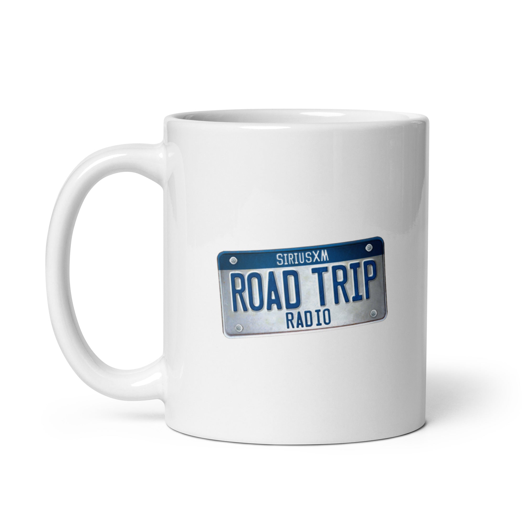 White mug featuring a design with a plate that reads 'SIRIUSXM ROAD TRIP RADIO' in blue and grey.
