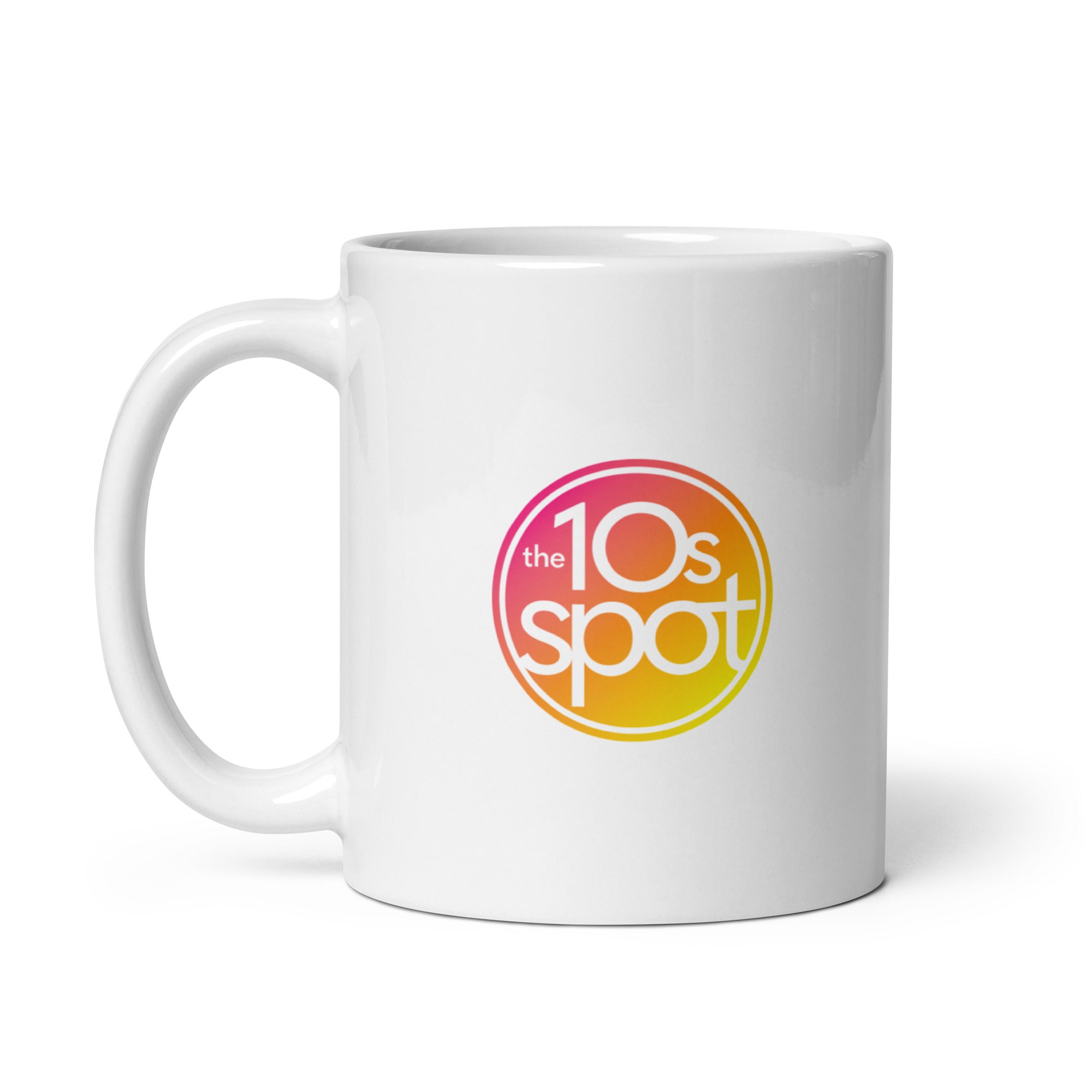 White mug featuring a colorful logo of 'the 10s spot' in a circular pink and orange design.