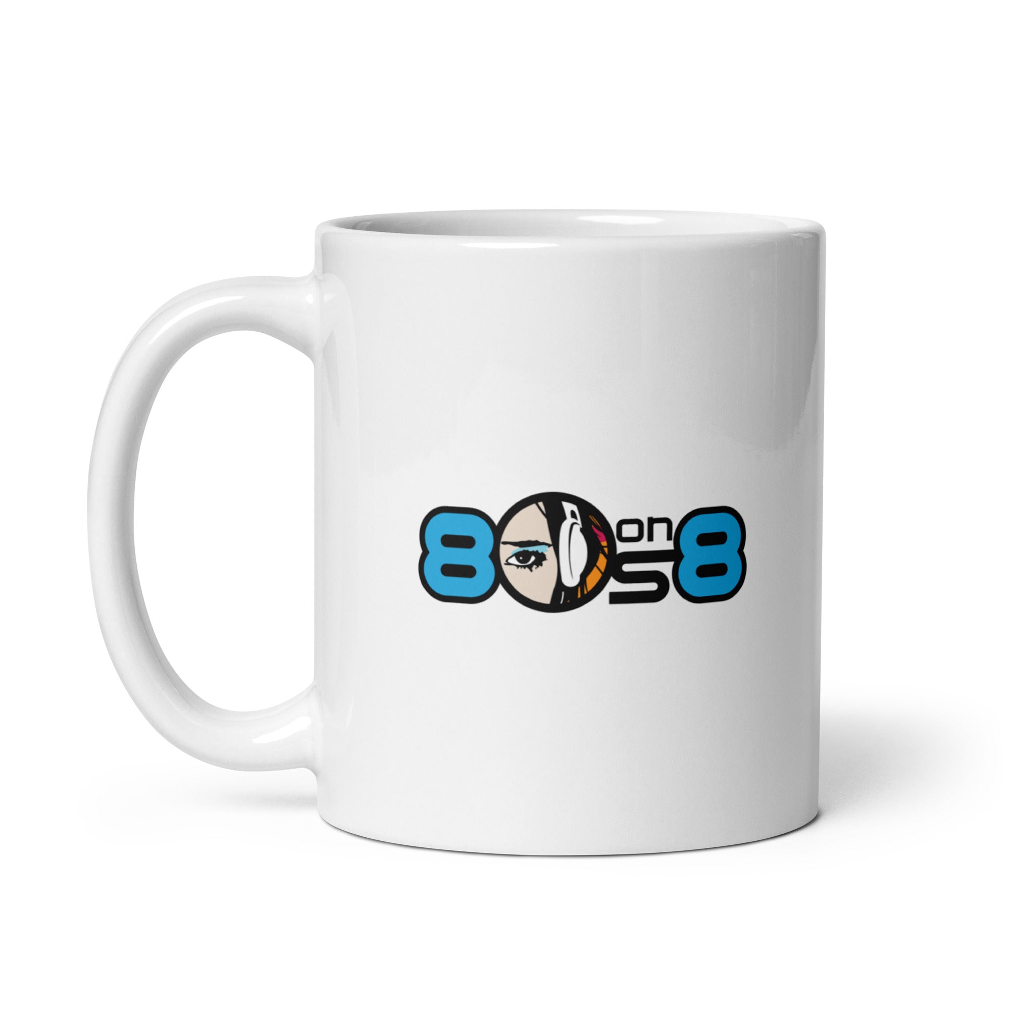 White coffee mug featuring a colorful '80s on 8' logo with a stylized face with eye and headphones design.