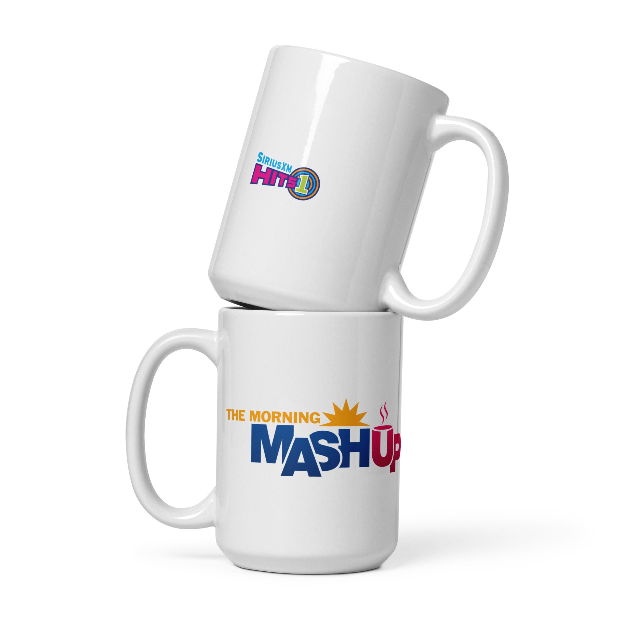 Two white coffee mugs stacked, one with 'SIRIUSXM HITS 1' logo on one side and the other featuring 'THE MORNING MASHUP' logo on the other.