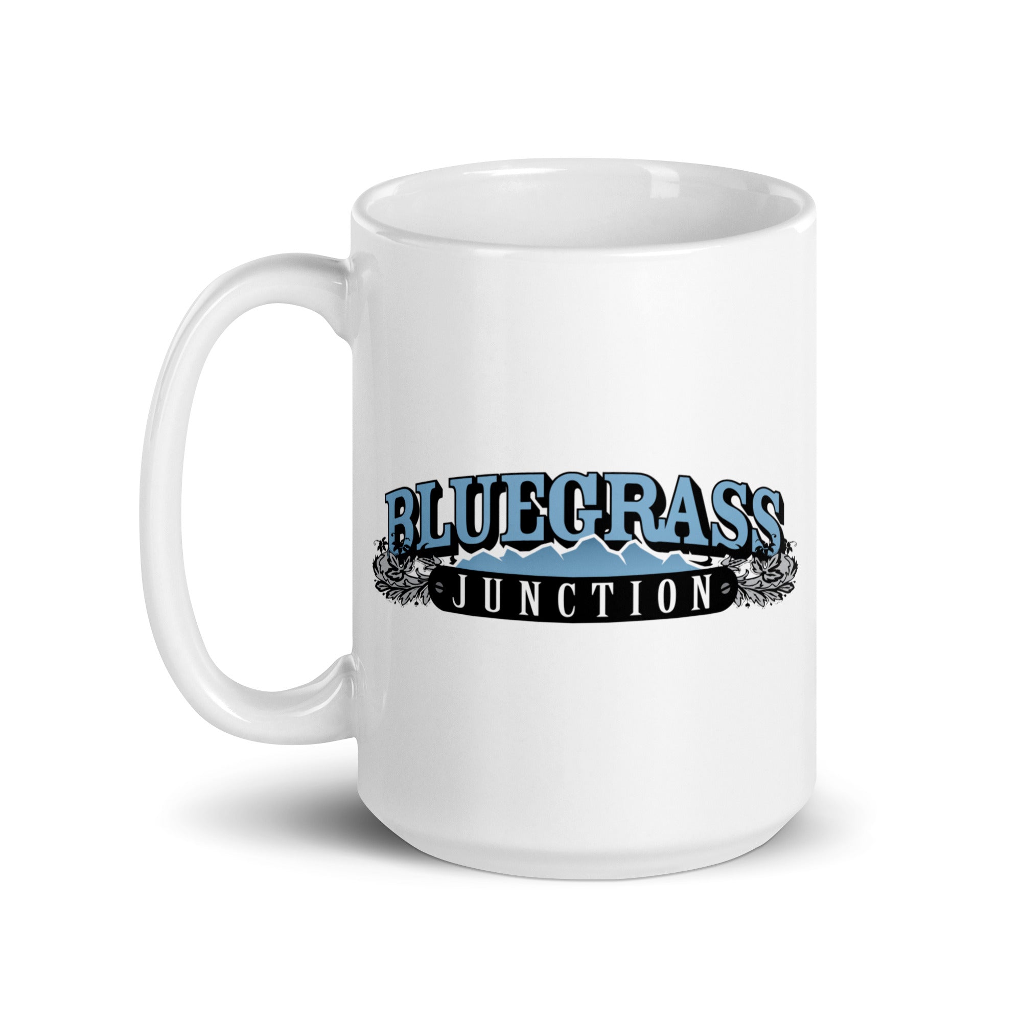 White mug featuring 'BLUEGRASS JUNCTION' logo in blue and black with decorative elements.
