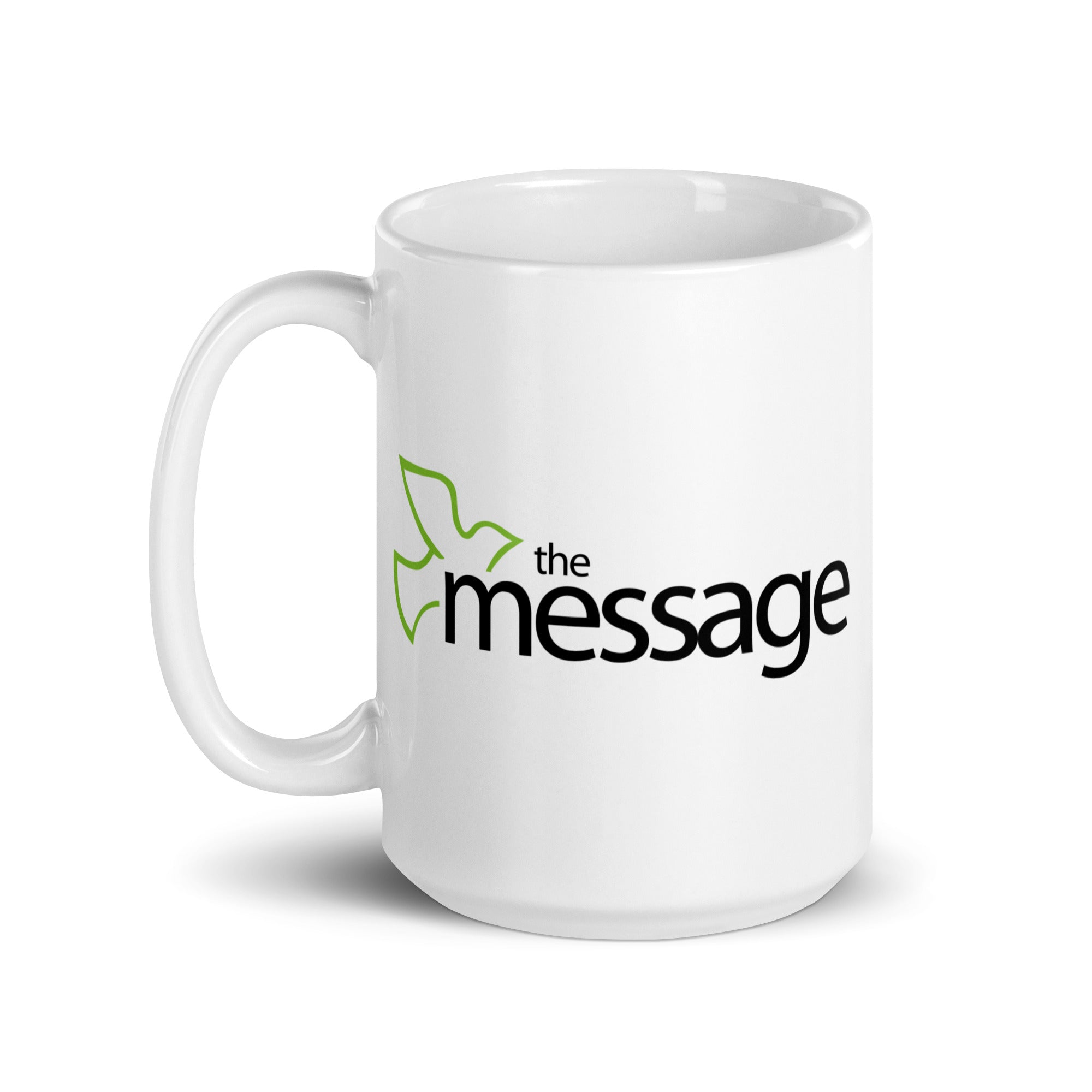 White ceramic mug featuring the text 'the message' with a green bird element.