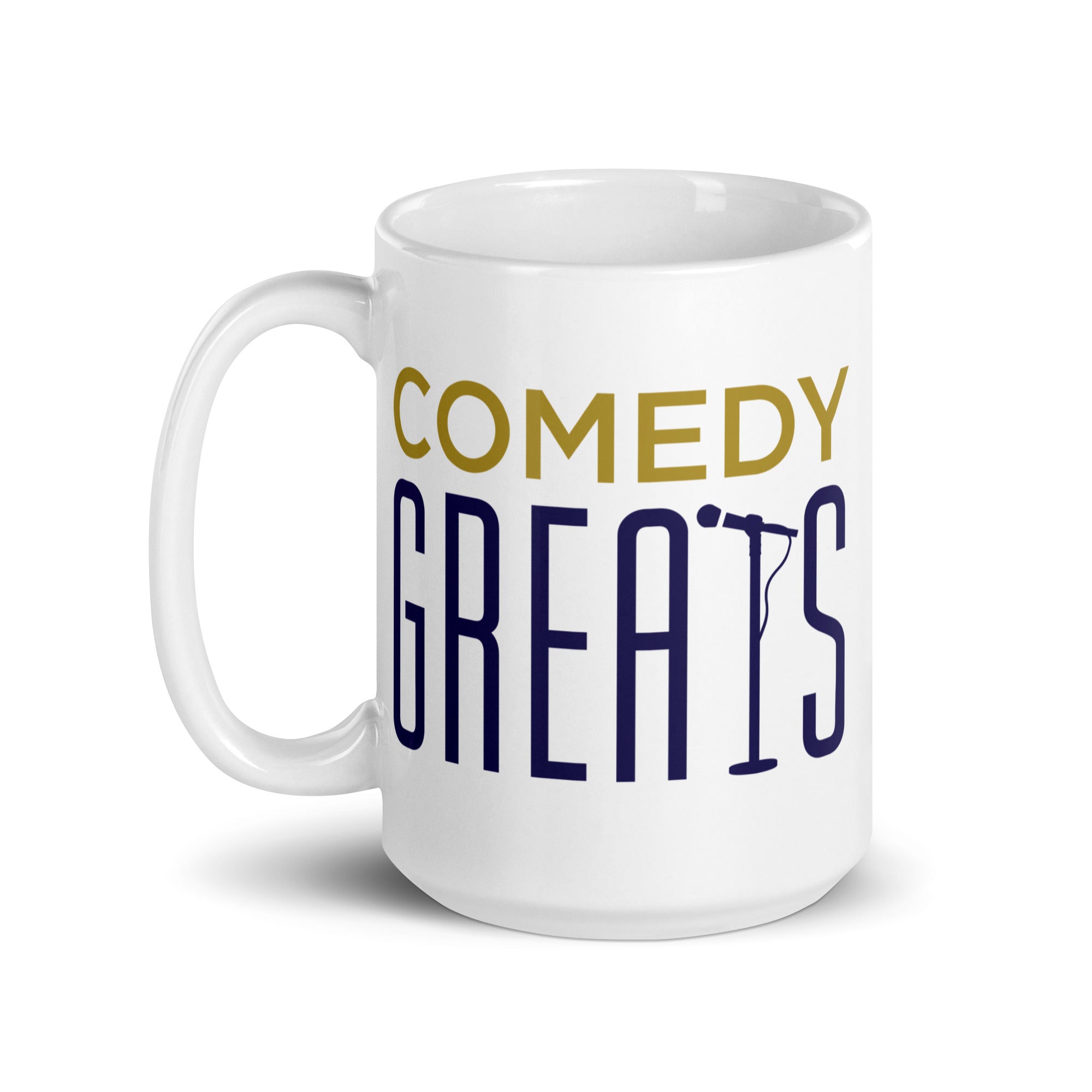 White coffee mug with 'COMEDY GREATs' printed in yellow and purple, featuring a microphone icon.