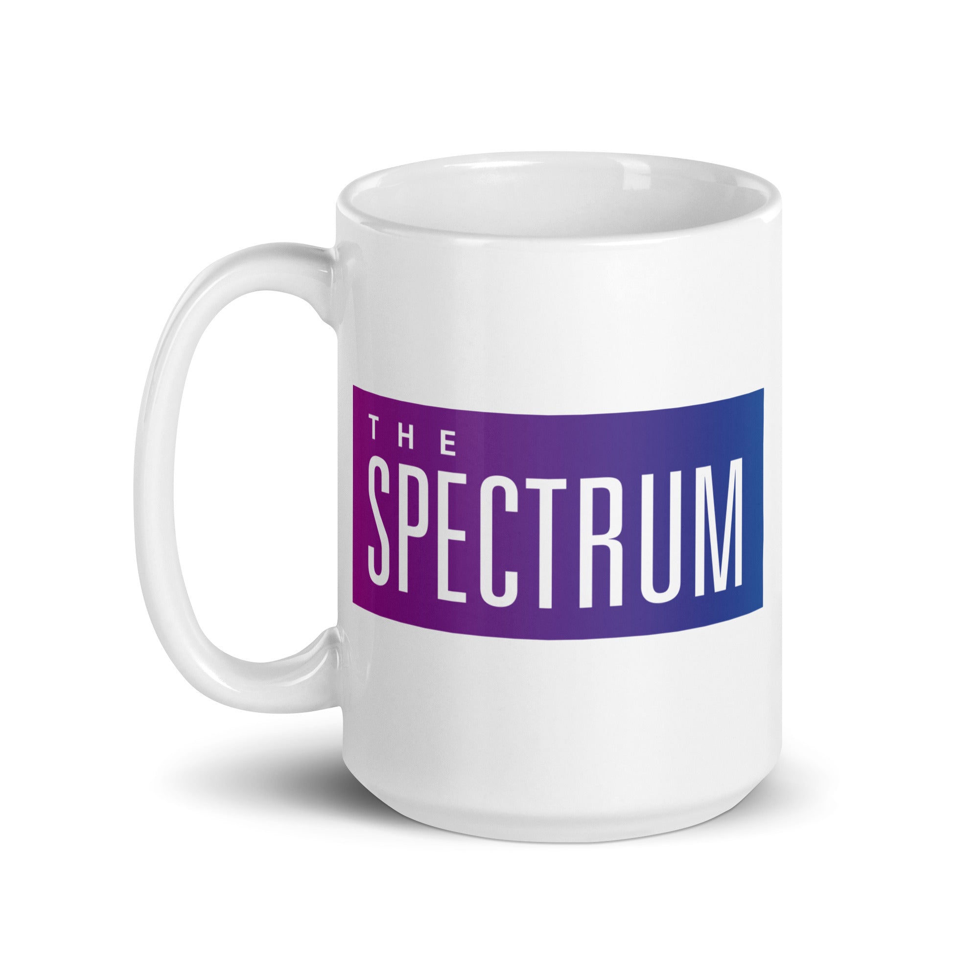 A white mug featuring the text 'THE SPECTRUM' in a gradient of purple and blue.