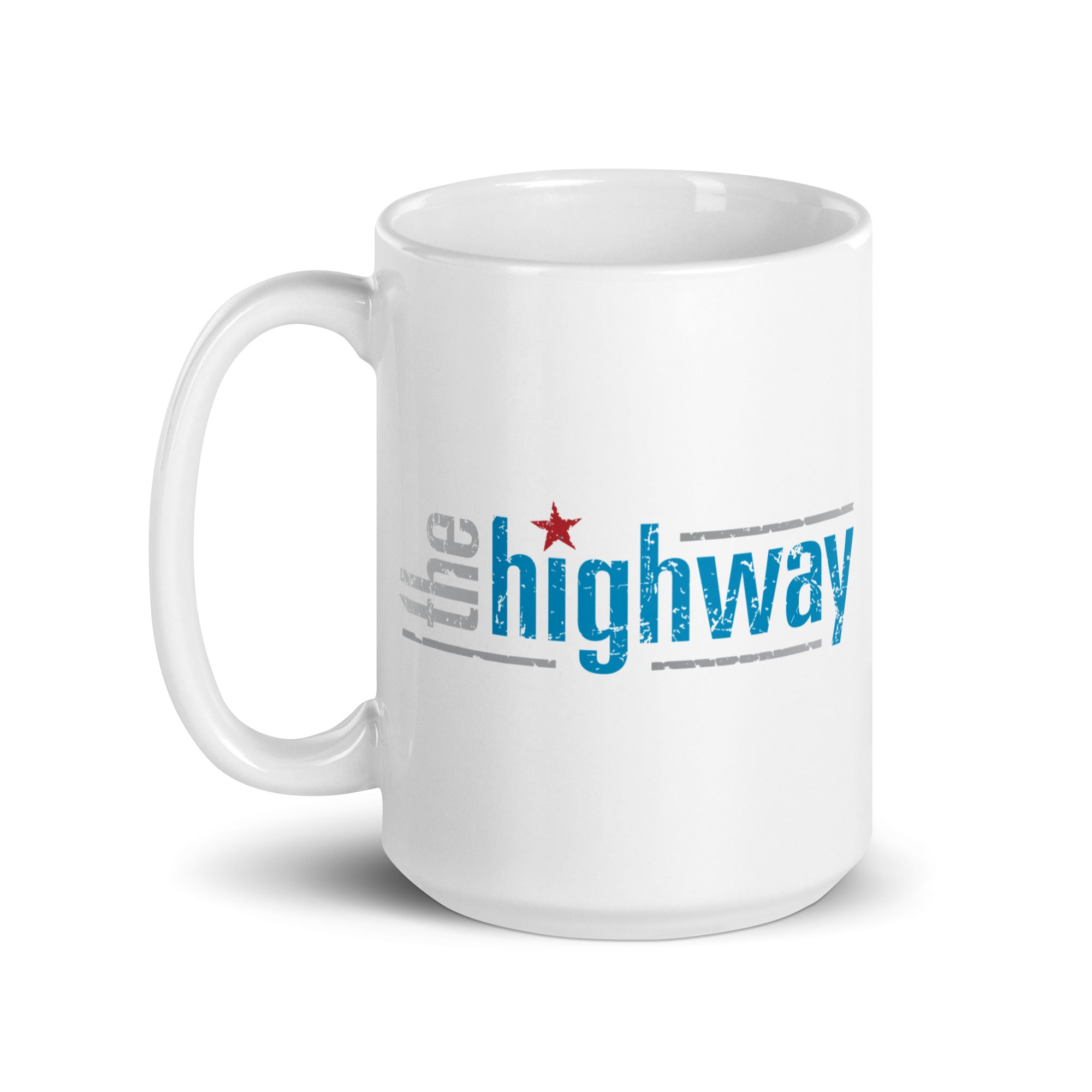 White coffee mug with the text 'the highway' in in blue, gray, and red colors, with a star element.