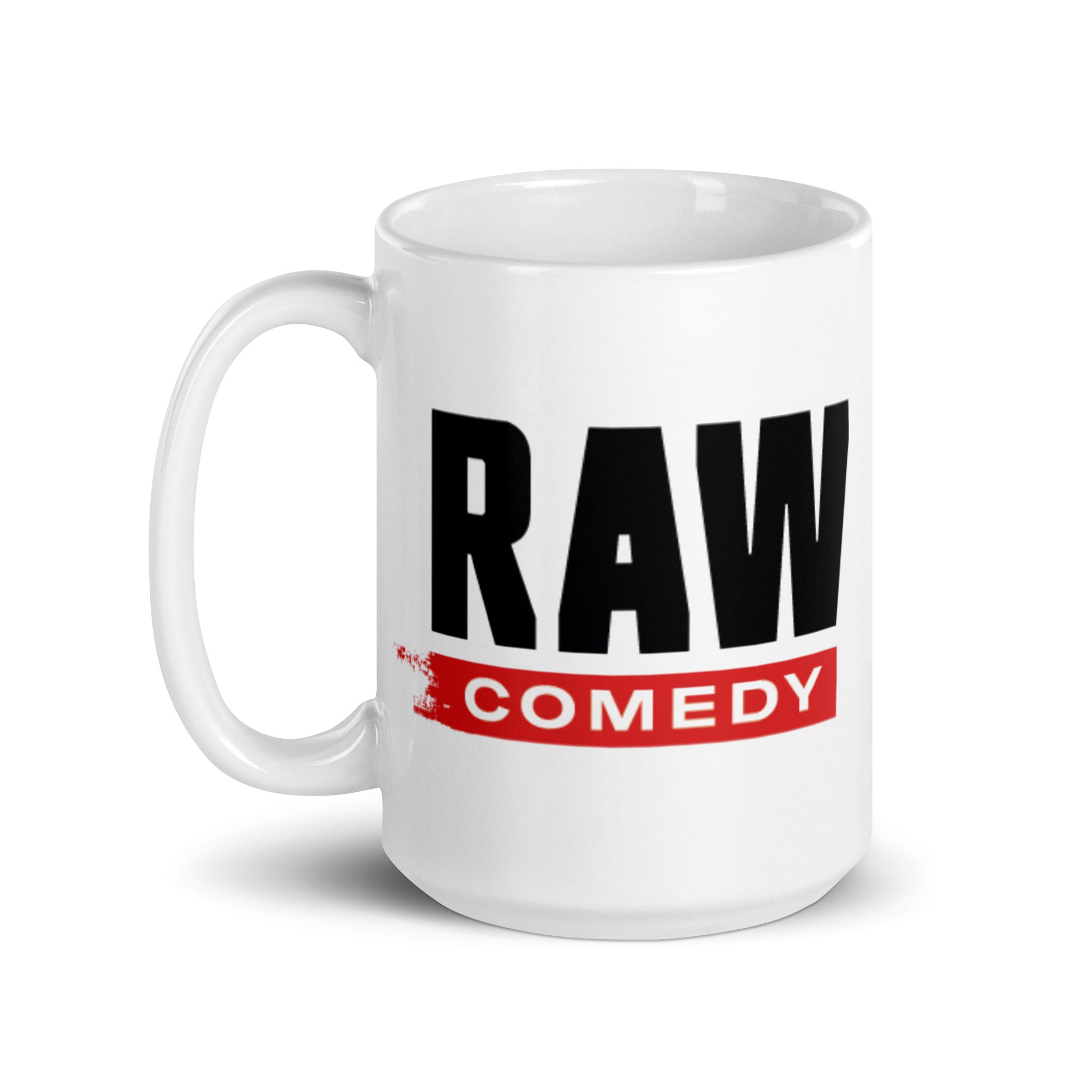 White coffee mug with bold text 'RAW COMEDY' printed in black and red.