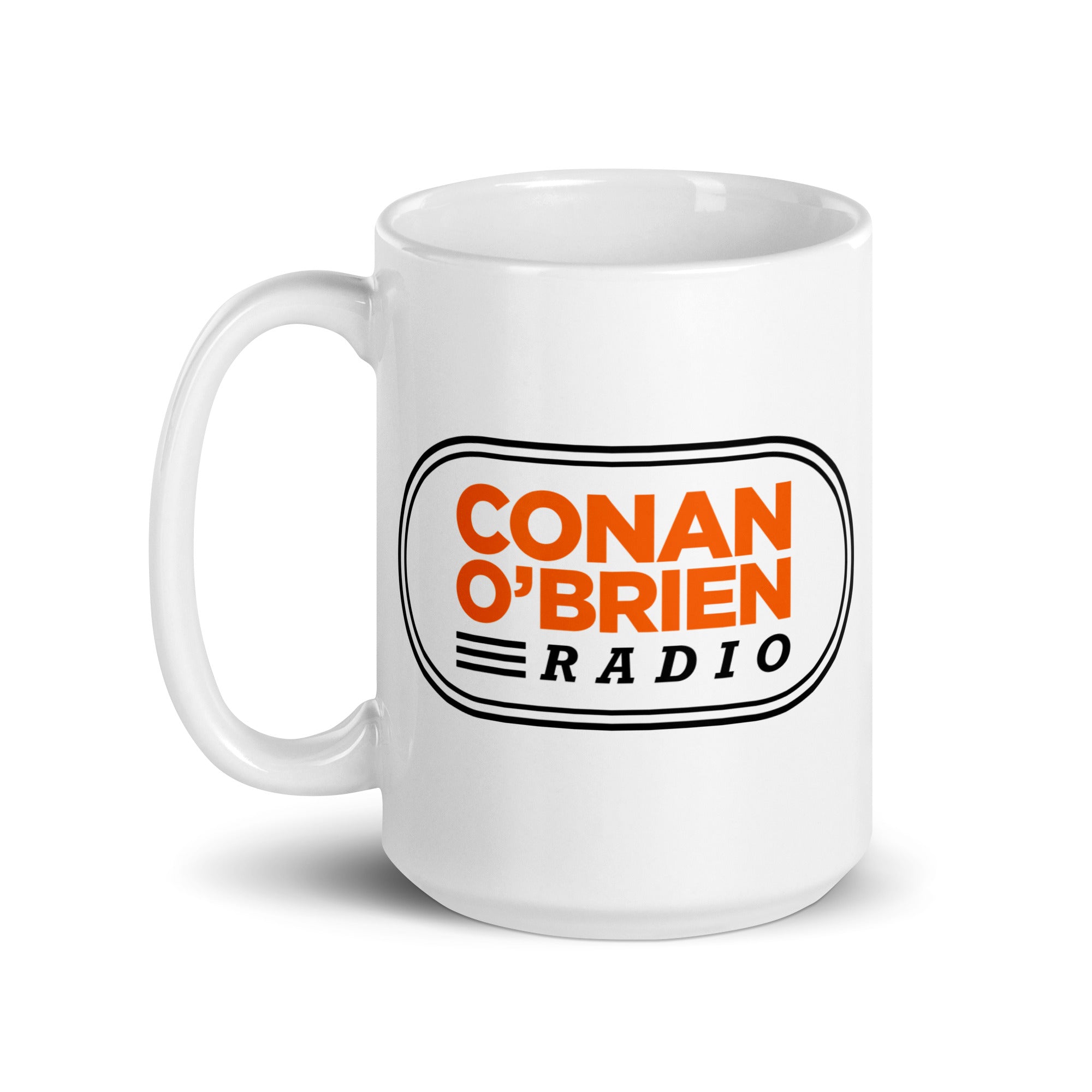 White mug with 'CONAN O'BRIEN RADIO' in orange and black lettering.