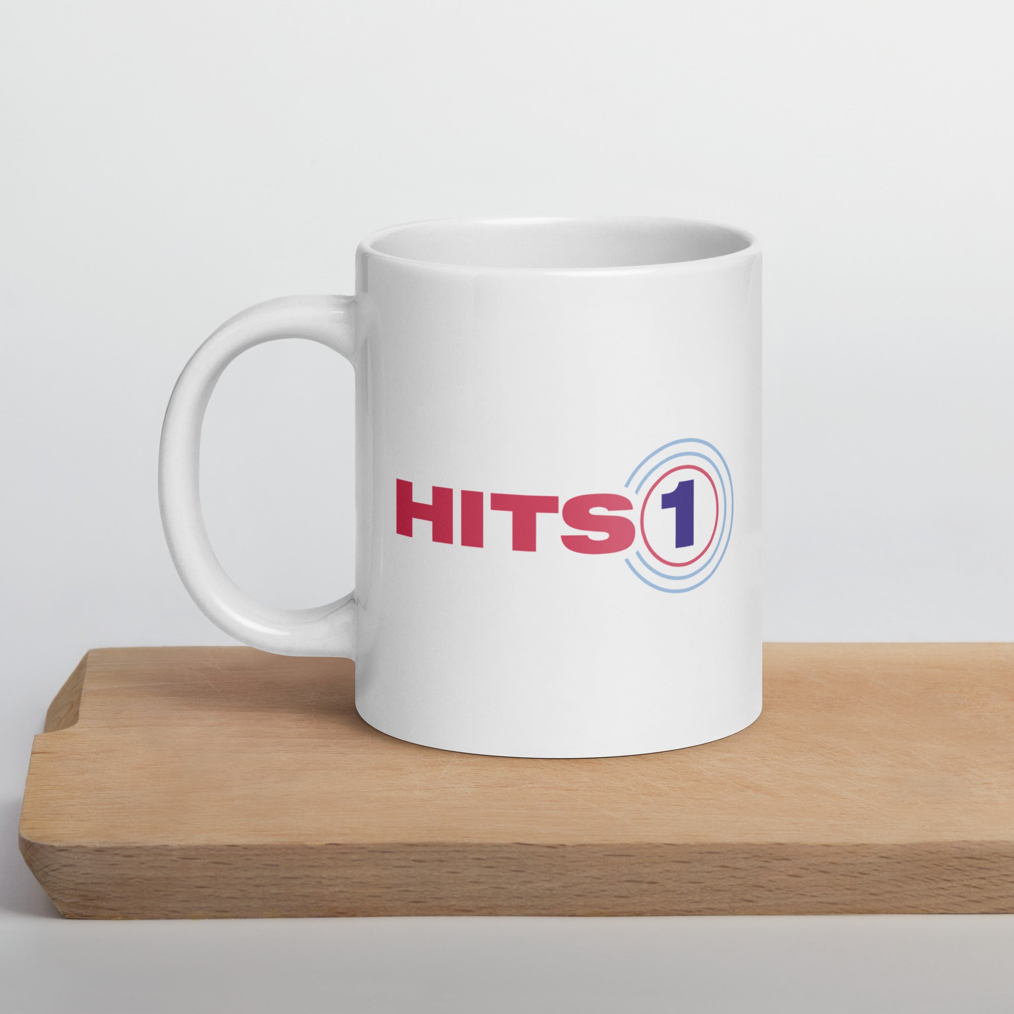 White mug with Hits 1 logo on front.