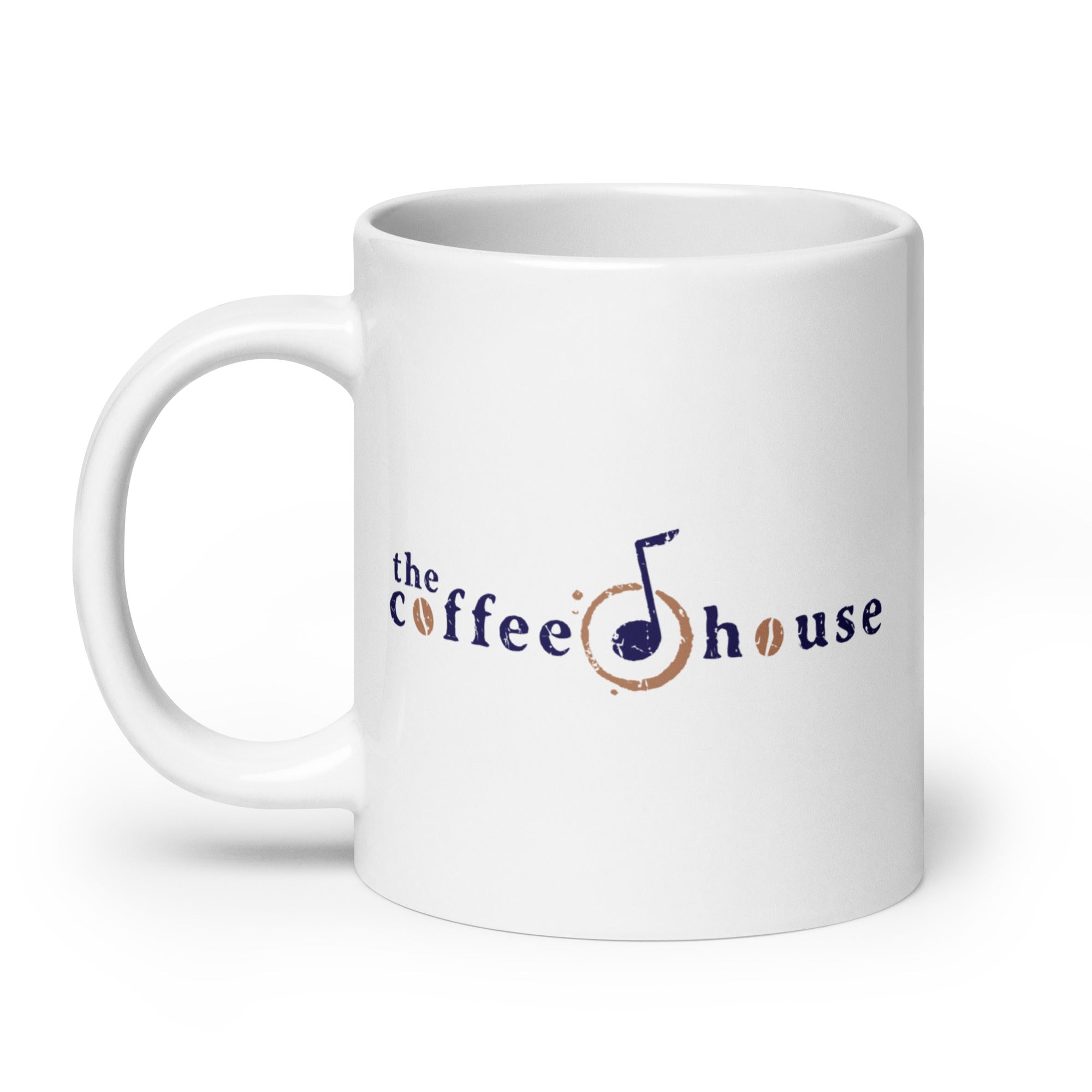 White mug featuring the logo of 'the coffee house' with a musical note and coffee bean design.