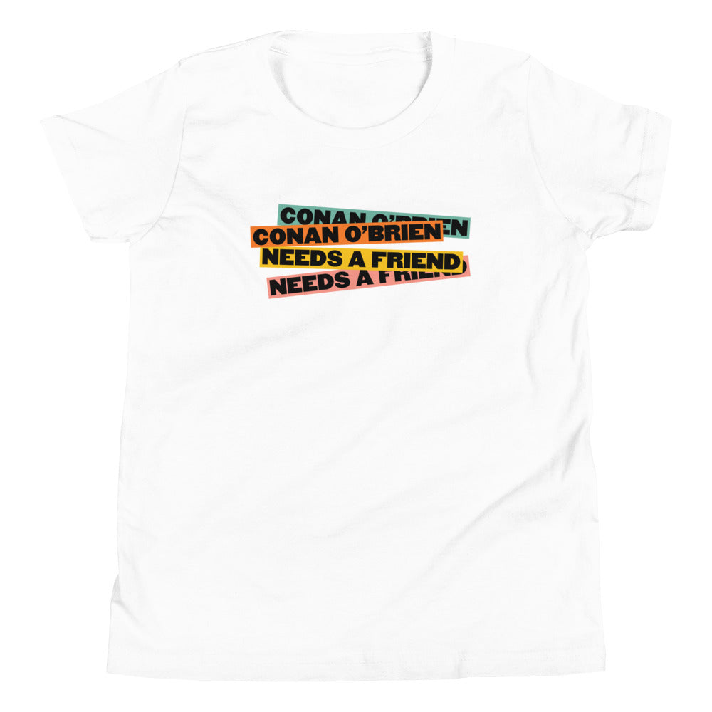 White t-shirt with colorful text: 'Conan O’Brien Needs a Friend' printed in various styles.